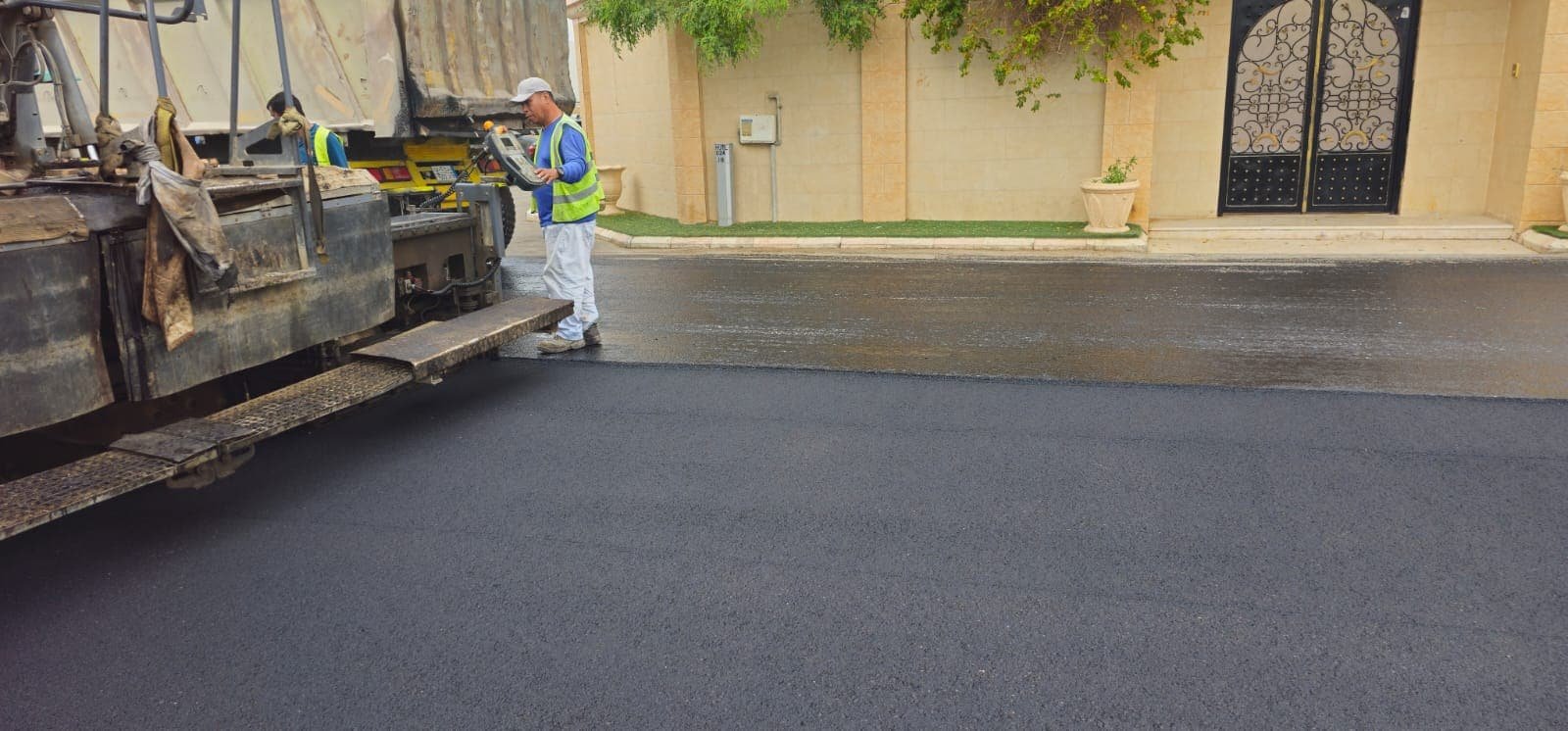 Asphalt paver finishing a residential street